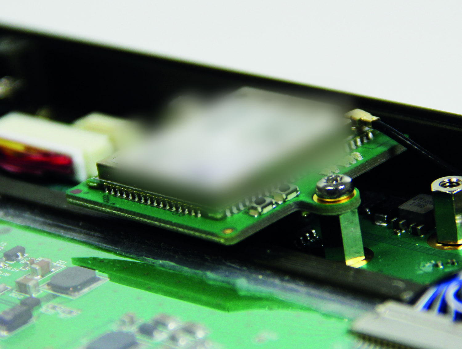 Third-party radio seated on the module carrier inside a BeastTX module slot