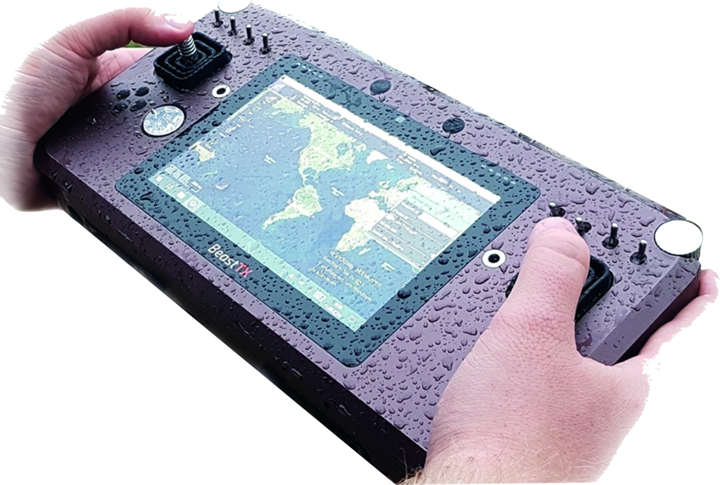 BeastTX held in two hands in the rain, water beaded across the housing and the display, mission map still readable
